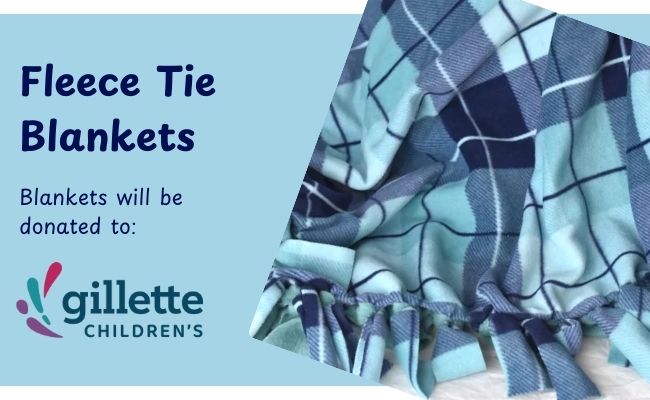 Dark and light blue plaid fleece tie blanket. Blankets will be donated to Gillett Children's Hospital